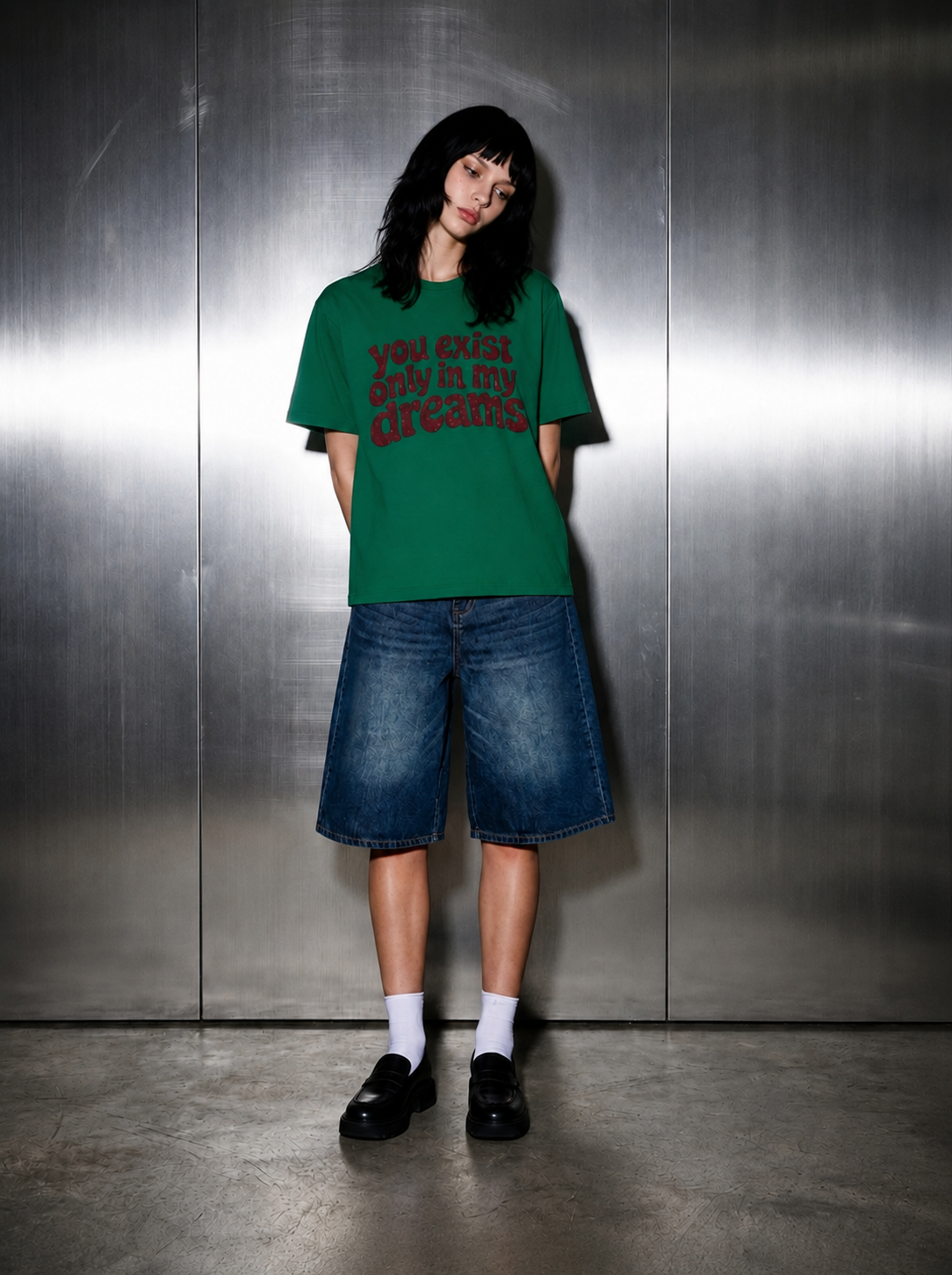 You Exist Only In My Dreams Tee kelly green worn by female 
model — oversized fit, styled with baggy denim shorts 
white socks and black loafers, Nostalgic Misfits streetwear