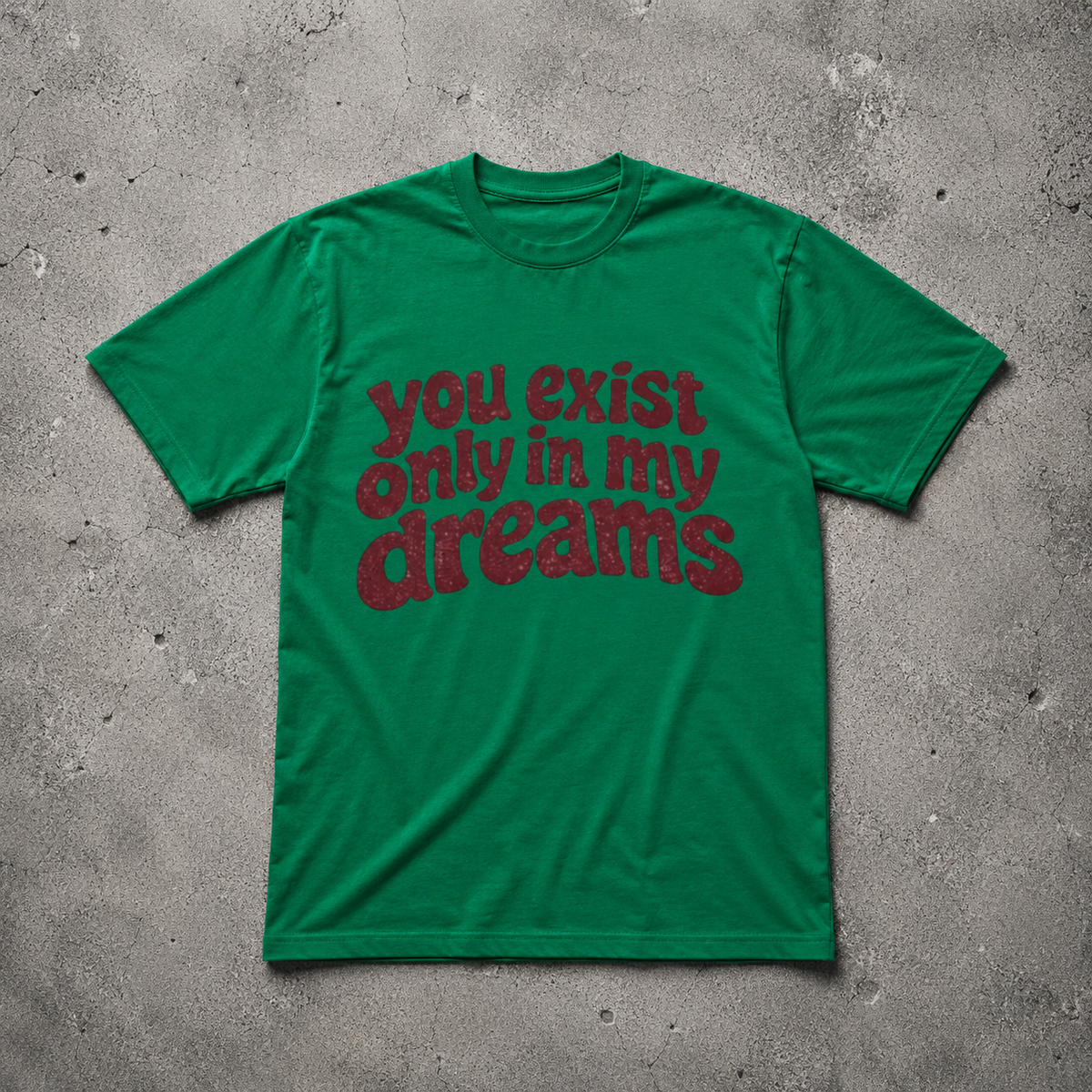 You Exist Only In My Dreams Tee kelly green oversized 
vintage graphic t-shirt flat lay on concrete — retro bubble 
letter screen print, Nostalgic Misfits limited edition