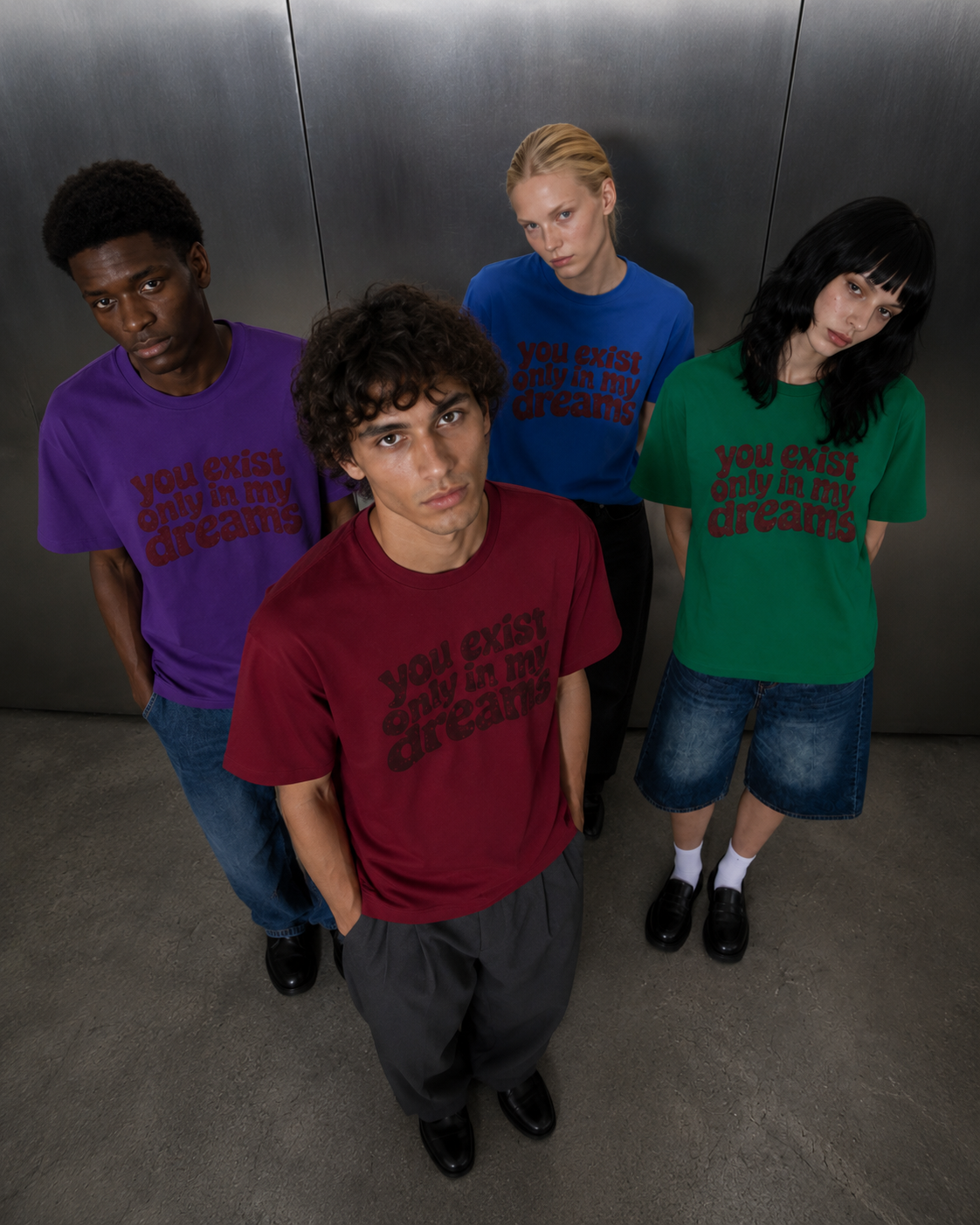 You Exist Only In My Dreams Tee — all four colorways worn 
by group of models, red green blue purple oversized vintage 
screen print t-shirt, Nostalgic Misfits limited drop streetwear