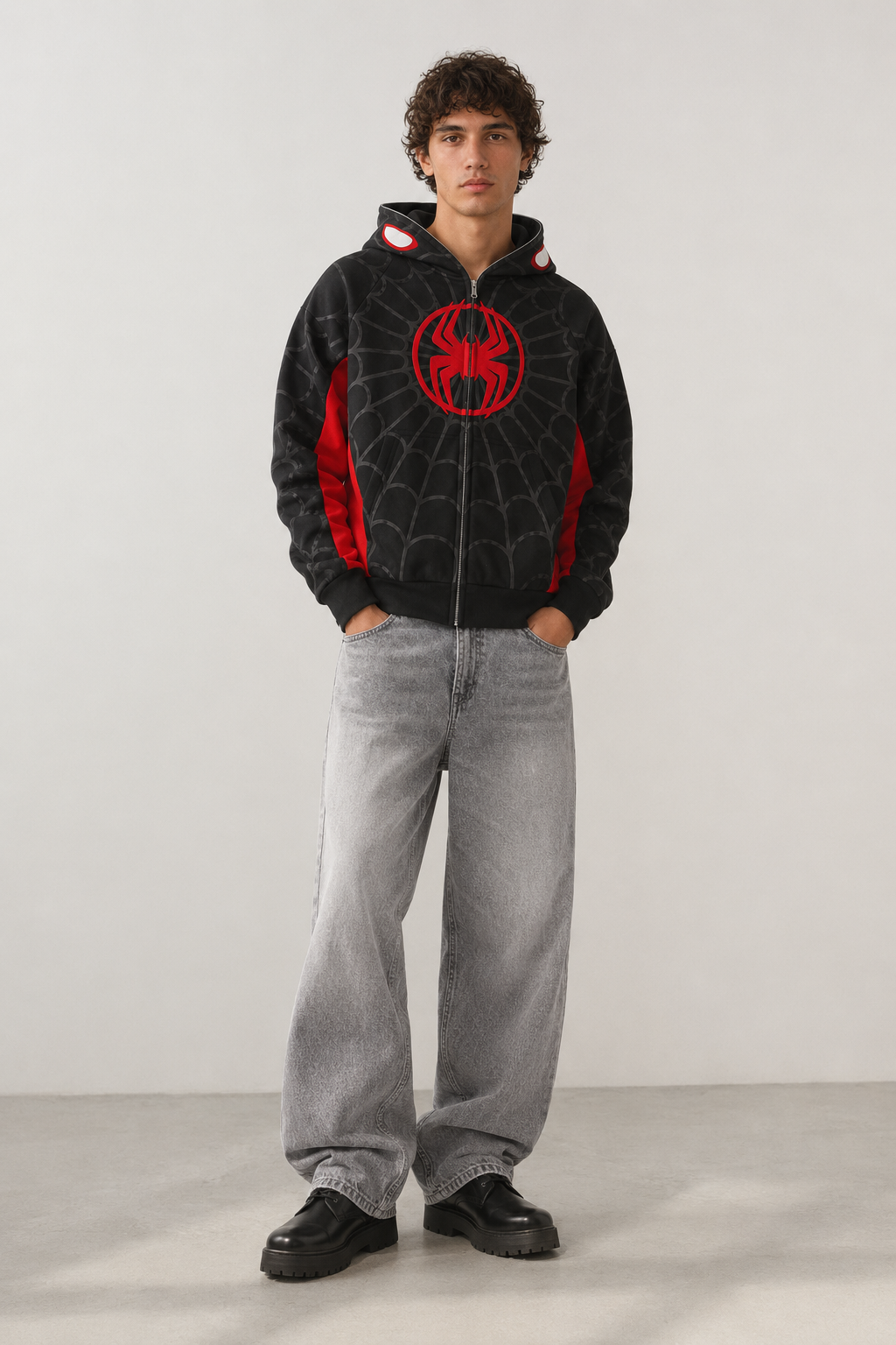 Nostalgic Misfits Miles Zip black red spidey hoodie front view model wearing baggy grey jeans red spider logo in circle on chest spidey eyes visible on open hood y2k streetwear style