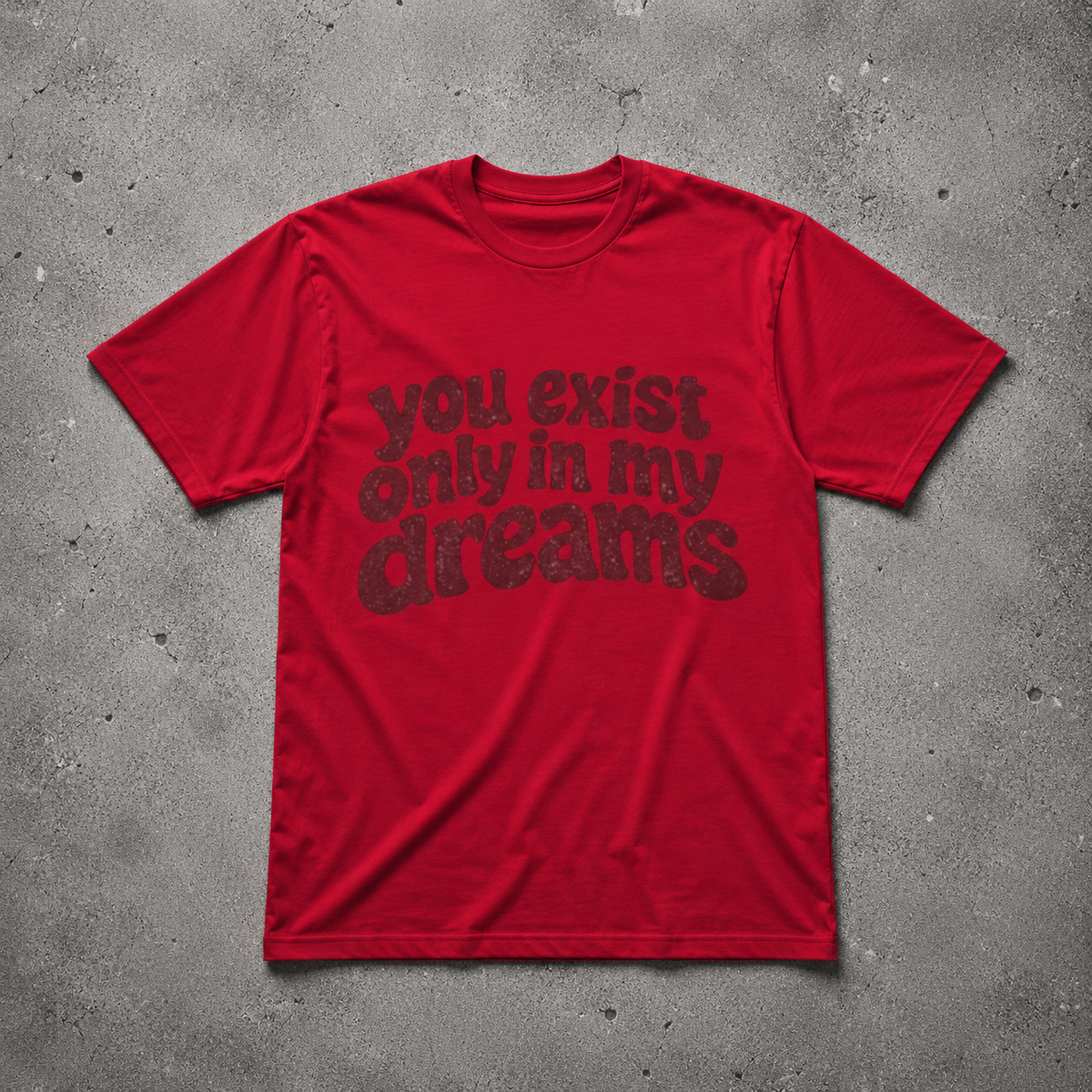 You Exist Only In My Dreams Tee red oversized vintage 
graphic t-shirt flat lay on concrete — retro bubble letter 
screen print, Nostalgic Misfits limited edition streetwear